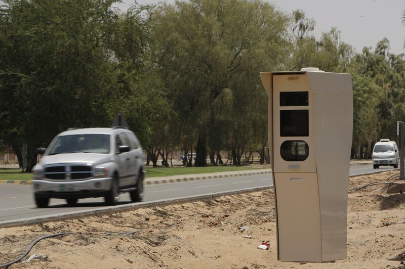 Abu Dhabi Police said using a phone while driving is the main cause of missing a red light. Ryan Carter / The National 