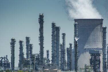 Vapour rises from cooling towers at Sasol's Secunda coal-to-liquids plant in South Africa. Key oil and gas companies have pledged to lower their emissions to combat climate change. Bloomberg