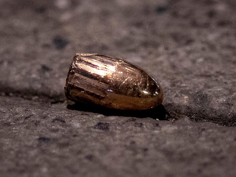 A projectile lies on the sidewalk near a restaurant at the scene of a shooting in central Hanau. AP