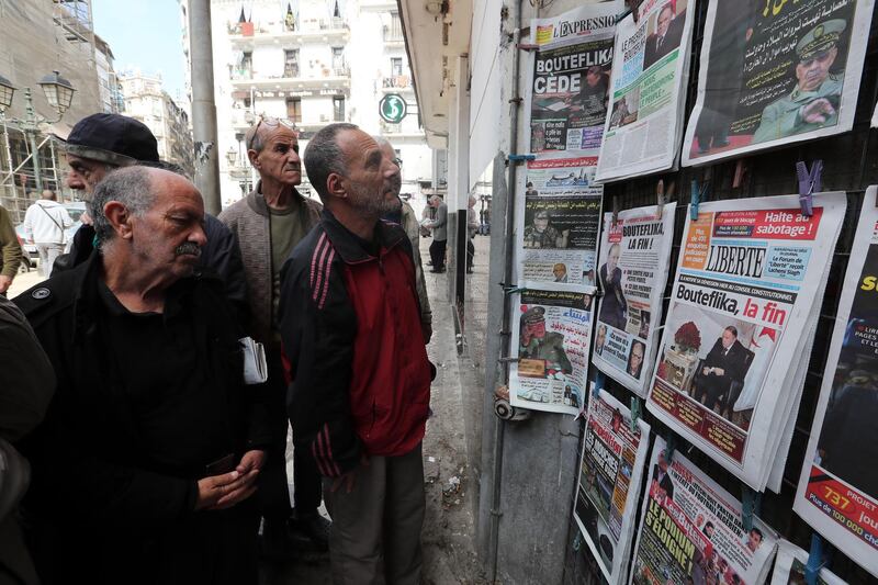 epa07482356 Algerian men look at local newspapers a day after Algeria's President Abdelaziz Bouteflika submitted his resignation, in Algiers, Algeria, 03 April 2019. According to official media reports late 02 April 2019, Bouteflika has announced his resignation, after weeks of popular mobilization against his rule and his intention to run for a fifth term in the upcoming presidential elections. Mr. Bouteflika withdrew from running for a new term but canceled Algeria's presidential election, which had been set for April 18.  EPA/MOHAMED MESSARA