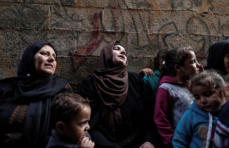 Relatives of fisherman Mustafa Abu Awda mourn during his funeral in Gaza City. AFP