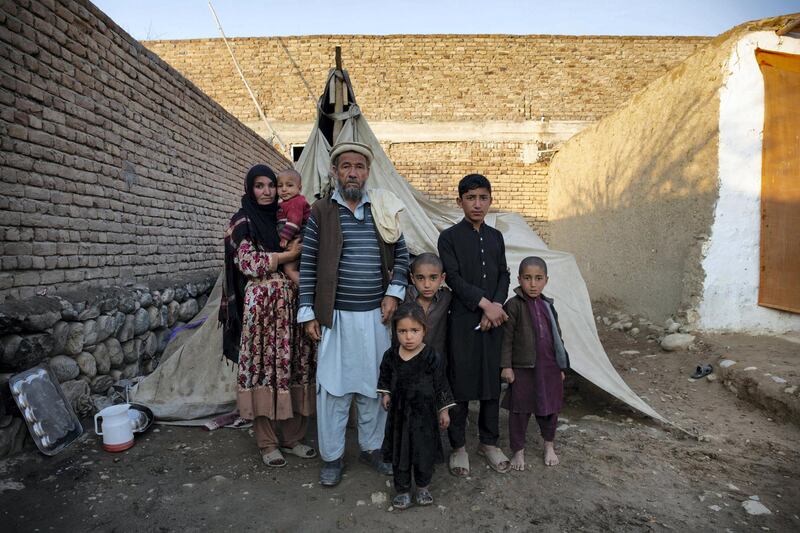 Aqeeda, her father and her children in 'Kabul Camp'. Lynzy Billing for The National