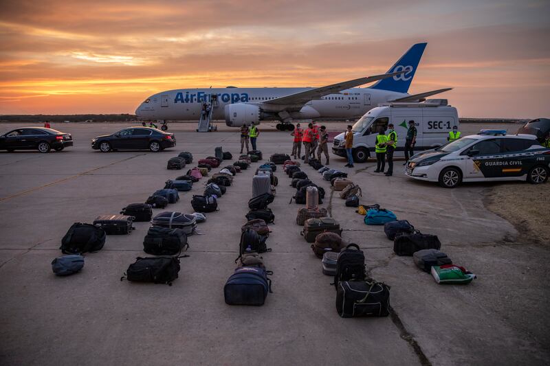 Belongings of Afghan people, who were evacuated from Kabul, are laid on the ground at Torrejon Military Air Base on August 24, 2021 in Madrid. Getty Images