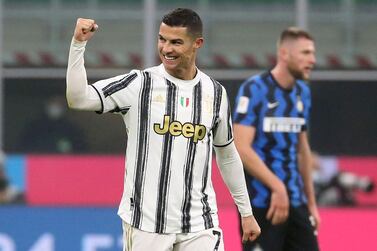 epa08982555 Juventusâ€™ Cristiano Ronaldo celebrates after scoring the 1-2 goal during the Italy Cup semifinal first leg soccer match between FC Inter and Juventus FC at Giuseppe Meazza stadium in Milan, Italy, 02 February 2021. EPA/MATTEO BAZZI