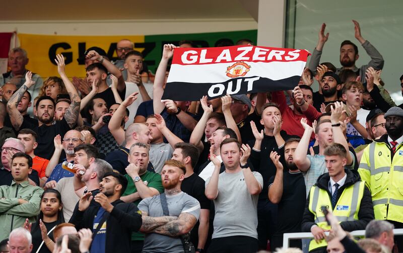 Manchester United fans wave anti-Glazer banners in the stands during a Premier League match at Old Trafford in September. PA