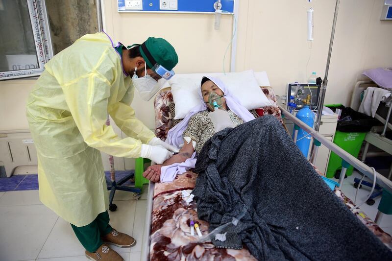 A patient is connected to an oxygen tank in the Intensive Care Unit ward for COVID-19 patients at the Afghan-Japan Communicable Disease Hospital in Kabul, Afghanistan, Tuesday June 30, 2020. (AP Photo/Rahmat Gul)