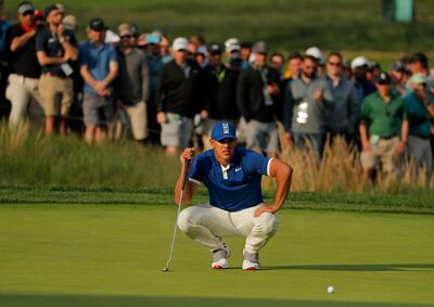 Brooks Koepka lines up a putt on the 17th green during the second round of the PGA Championship golf tournament, Friday, May 17, 2019, at Bethpage Black in Farmingdale, N.Y. (AP Photo/Andres Kudacki)