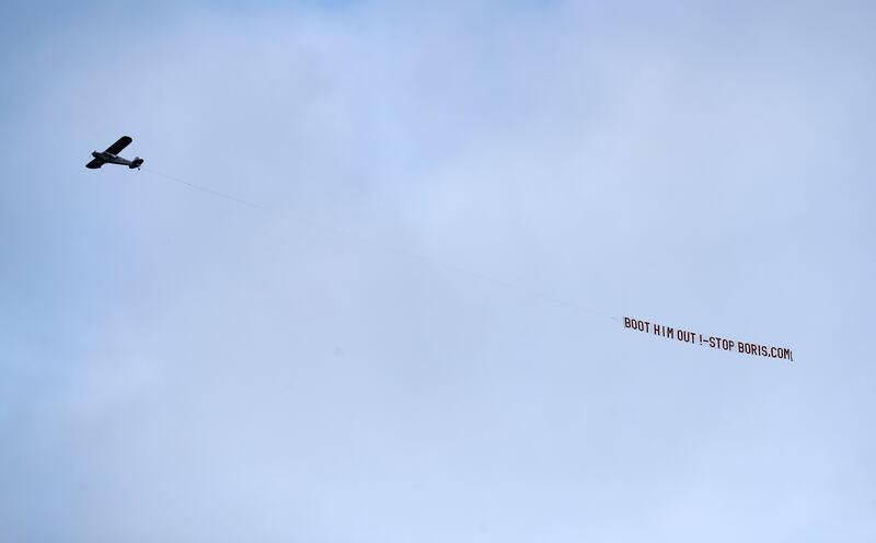 A plane flies over Elland Road stadium in Leeds with a message directed to Mr Johnson during the Premier League match between Leeds United and Newcastle United. Getty Images