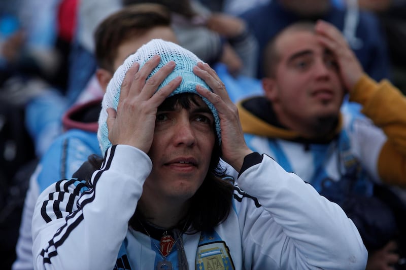 An Argentina fan reacts as he watches a broadcast of the World Cup Group D Argentina vs Nigeria match, at a public viewing area at a square in Buenos Aires, Argentina, June 26, 2018. Martin Acosta / Reuters