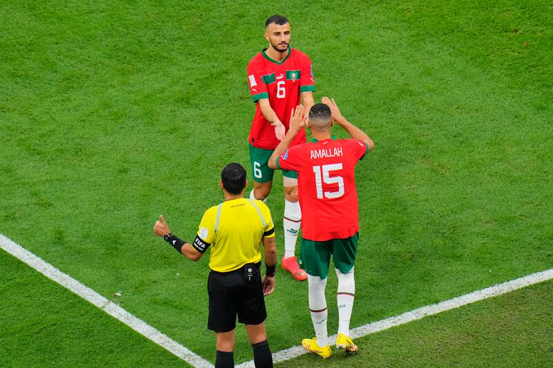Morocco's Romain Saiss is substituted by Selim Amallah during the first half. AP
