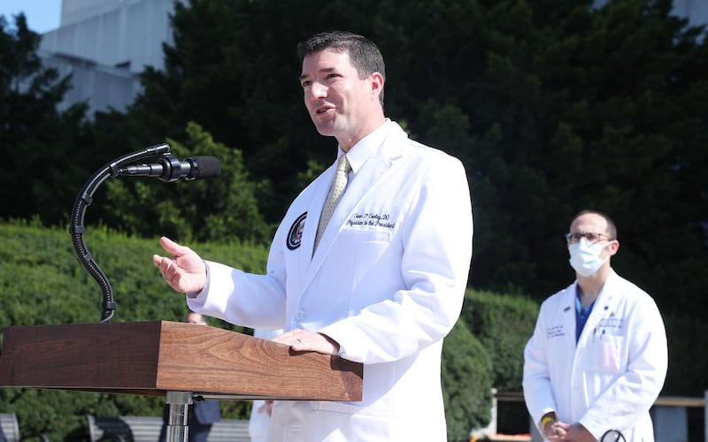 Dr. Sean Conley, White House physician, speaks during a press conference outside of Walter Reed National Military Medical Center in Bethesda, Maryland, U.S., on Sunday, Oct. 4, 2020. President Donald Trump may be discharged from the hospital as soon as Monday as he recuperates from Covid-19, one of his doctors said Sunday, though they revealed he’s been administered a medicine to control inflammation. Photographer: Michael Reynolds/EPA/Bloomberg