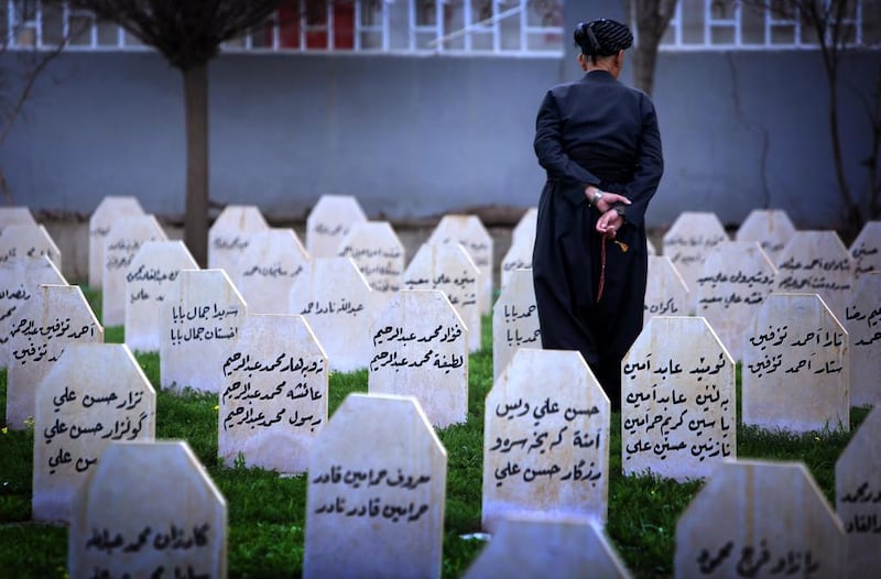 An Iraqi Kurd man visit at a grave yard and a monument for the victims who were killed in a gas attack by former Iraqi president Saddam Hussein.
