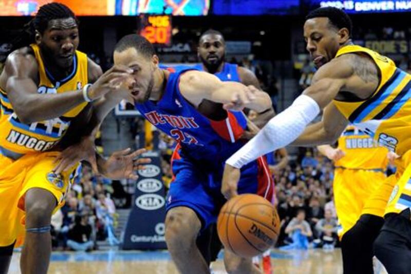 Denver Nuggets' Andre Iguodala, right, steals the ball from Tayshaun Prince of the Detroit Pistons during their NBA game.