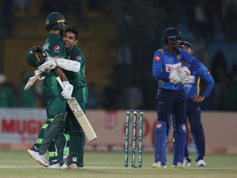 Pakistan's Abid Ali, second from left, celebrates his fifty against Sri Lanka in Karachi, Pakistan, Wednesday, Oct. 2, 2019. Pakistan capitalized on a brisk century opening stand between Fakhar Zaman and Abid Ali to beat Sri Lanka by five wickets in the third and final one-day international on Wednesday, clinching the series 2-0. (AP Photo/Fareed Khan)