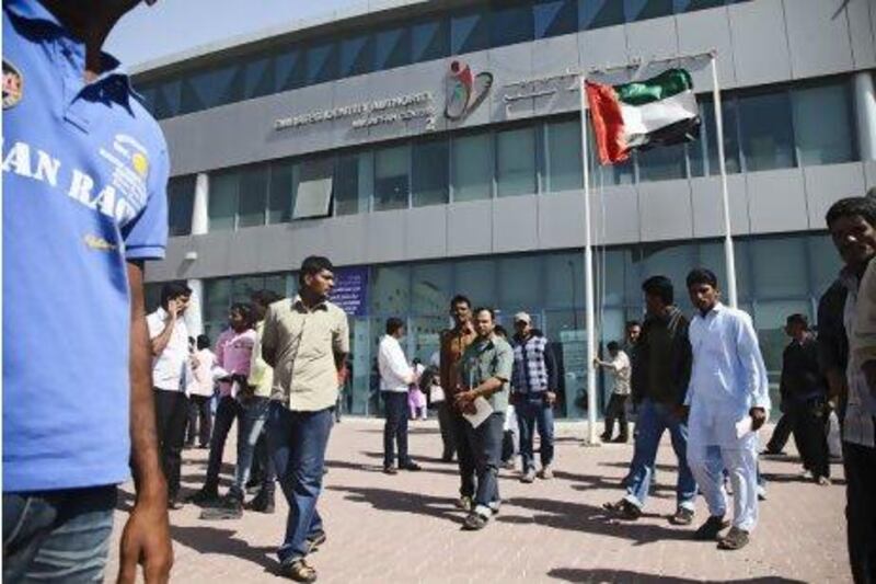 Hundreds of people descended upon the Emirates Identity Authority to obtain exit visas as the UAE amnesty draws to a close. Lee Hoagland / The National