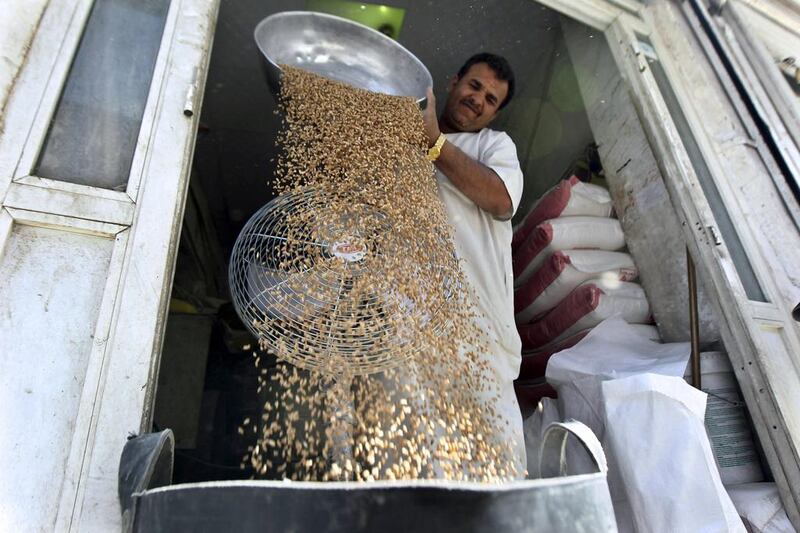 A man sorts wheat to be sold in Riyadh. Flour consumption in the country is expected to grow to grow to 2.6 million tonnes in 2019 from 2.3 million tonnes this year. Faisal Al Nasser / Reuters