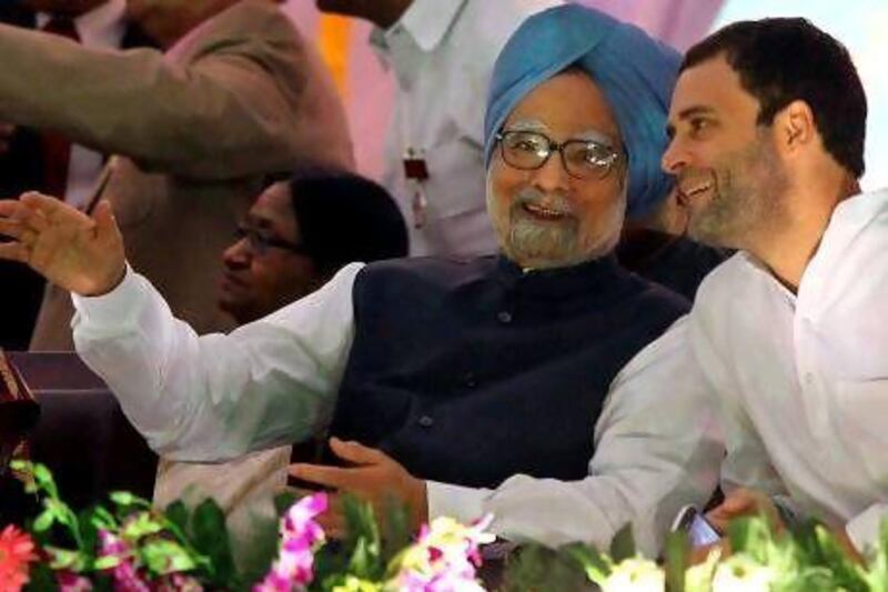 Indian prime minister Manmohan Singh, left, speaks with Congress party leader Rahul Gandhi during Dussehra celebrations in New Delhi last week. Mr Gandhi has not been included in the new cabinet.