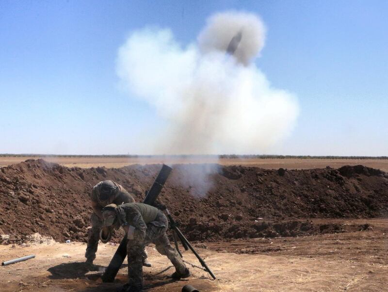 ALEPPO, SYRIA - SEPTEMBER 25: Free Syrian Army (FSA) Sultan Murad Brigade members launch rocket attack as they liberated Kadrish village from Daesh militants near the Cobanbey (Al-Rai) town in Jarabulus as they carry out an operation within the "Operation Euphrates Shield" led by Turkish Army and backed by Syrian National Coalition forces including Free Syrian Army (FSA) in Aleppo, Syria on September 26, 2016.  (Photo by Mohammed Nour/Anadolu Agency/Getty Images)