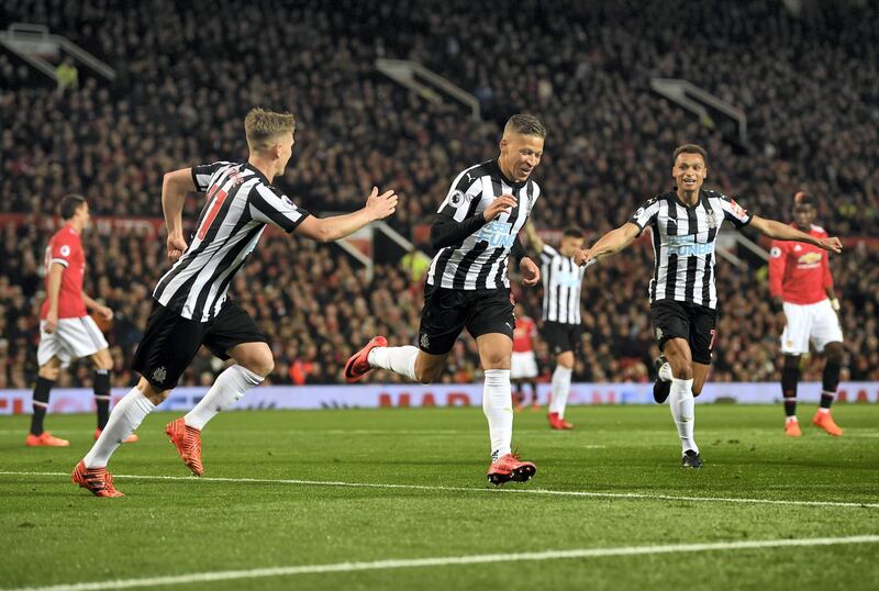 MANCHESTER, ENGLAND - NOVEMBER 18:  Dwight Gayle of Newcastle United celebrates with team mates after scoring his sides first goal during the Premier League match between Manchester United and Newcastle United at Old Trafford on November 18, 2017 in Manchester, England.  (Photo by Gareth Copley/Getty Images)