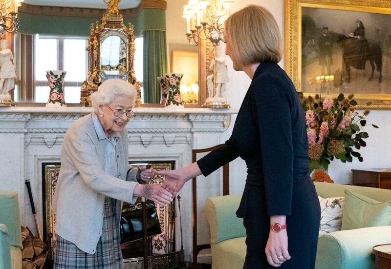 Queen Elizabeth II greets the newly elected leader of the Conservative Party, Ms Truss, at Balmoral Castle in Scotland. The queen invited Ms Truss to become prime minister and form a new government. Getty Images