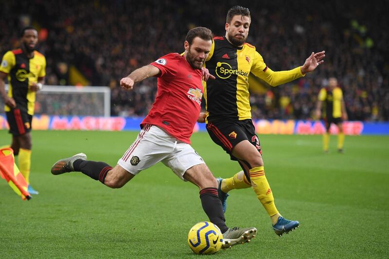 Manchester United midfielder Juan Mata vies with Watford's Spanish defender Kiko Femenia. AFP