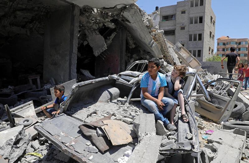 Palestinian children watch as members of a Palestinian band perform during a musical event calling to boycott the Eurovision Song Contest. Reuters