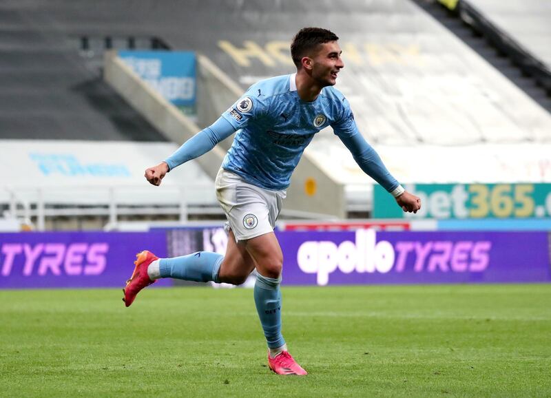 Manchester City's Ferran Torres celebrates after scoring their side's fourth goal of the game and his hat-trick during the Premier League match at St James' Park, Newcastle upon Tyne. Picture date: Friday May 14, 2021. PA Photo. See PA story SOCCER Newcastle. Photo credit should read: Scott Heppell/PA Wire.

RESTRICTIONS: EDITORIAL USE ONLY No use with unauthorised audio, video, data, fixture lists, club/league logos or "live" services. Online in-match use limited to 120 images, no video emulation. No use in betting, games or single club/league/player publications.