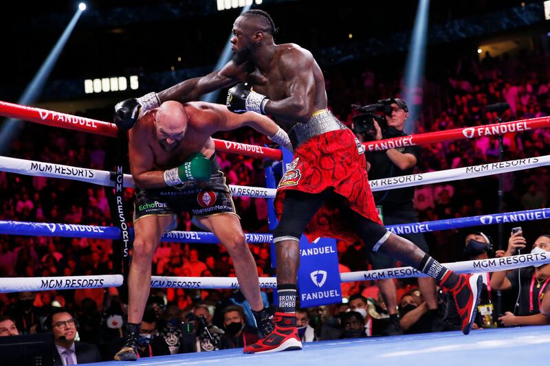 Deontay Wilder swings at Tyson Fury as the battle continuedn into round nine. AP