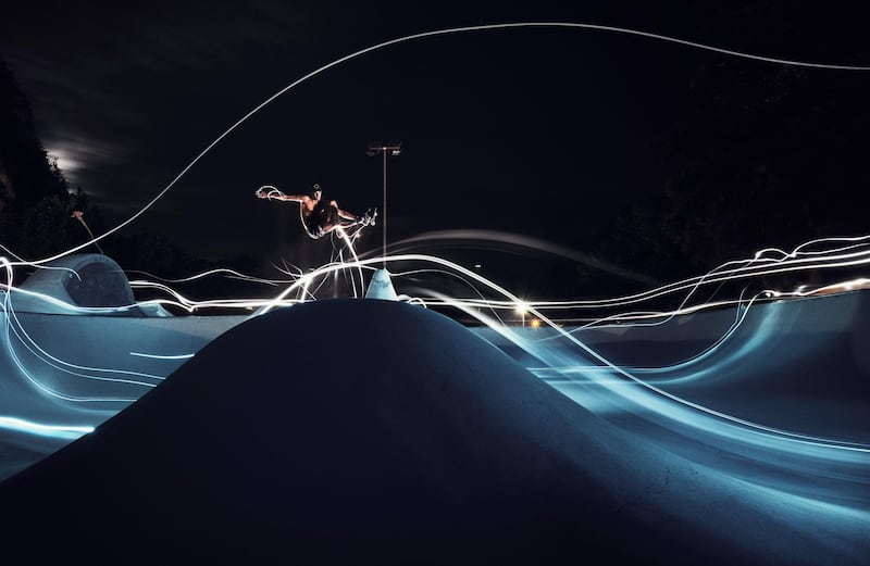 Olympic skateboard qualifier Tyler Edtmayer of Germany pulls a frontside air off the spine while wearing LED lights during training at The Cradle Skatepark in Brixlegg, Austria, on August 25. Getty
