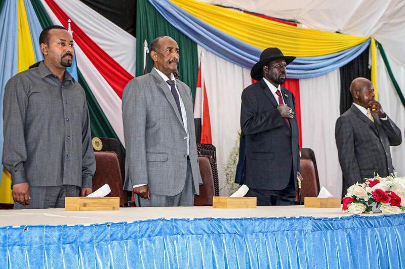 (From L) Ethiopian Prime Minister Abiy Ahmed, President of Sudanese Transitional Council General Abdel Fattah al-Burhan, President of South Sudan Salva Kiir and Uganda's President Yoweri Museveni attend a meeting to endorse the peace talks between Sudan's government and rebel leaders in Juba, South Sudan, on October 14, 2019.   / AFP / Peter LOUIS
