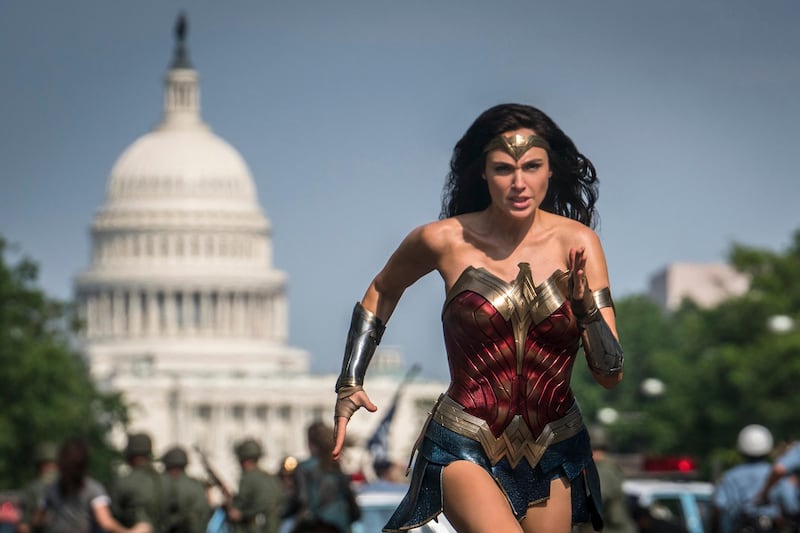 This image released by Warner Bros. Pictures shows Gal Gadot as Wonder Woman in a scene from "Wonder Woman 1984." The film isn't skipping theaters or moving to 2021, but it is altering course. The last big blockbuster holdout of 2020 is still opening in U.S. theaters on Christmas Day but it will also be made available to HBO Max subscribers free of charge for its first month, Warner Bros. said Wednesday, Nov. 18, 2020. (Clay Enos/Warner Bros Pictures via AP)