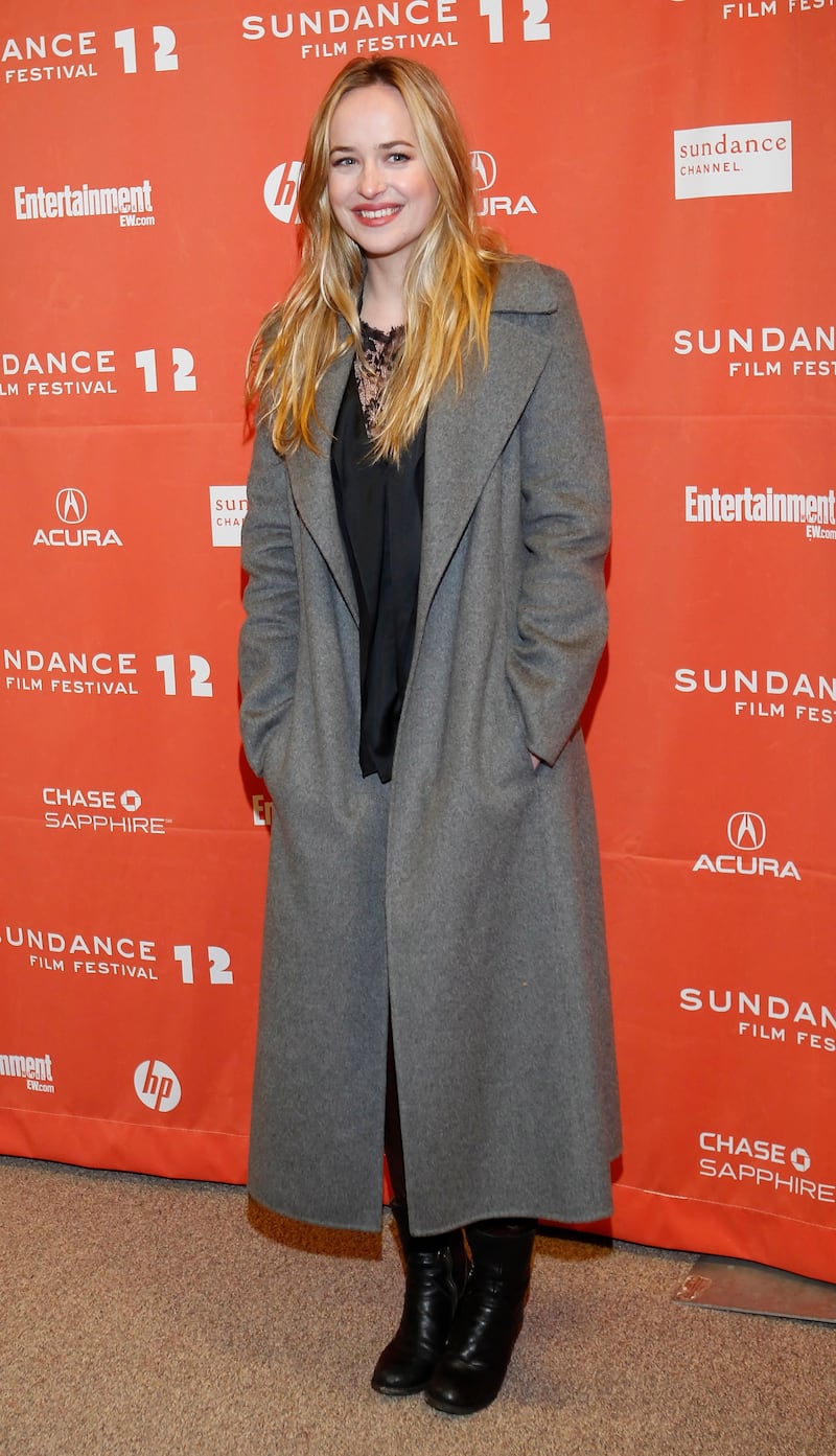 Dakota Johnson, in a grey coat, attends the premiere of 'Goats' at the Sundance Film Festival in Park City, Utah, on January 24, 2012. EPA