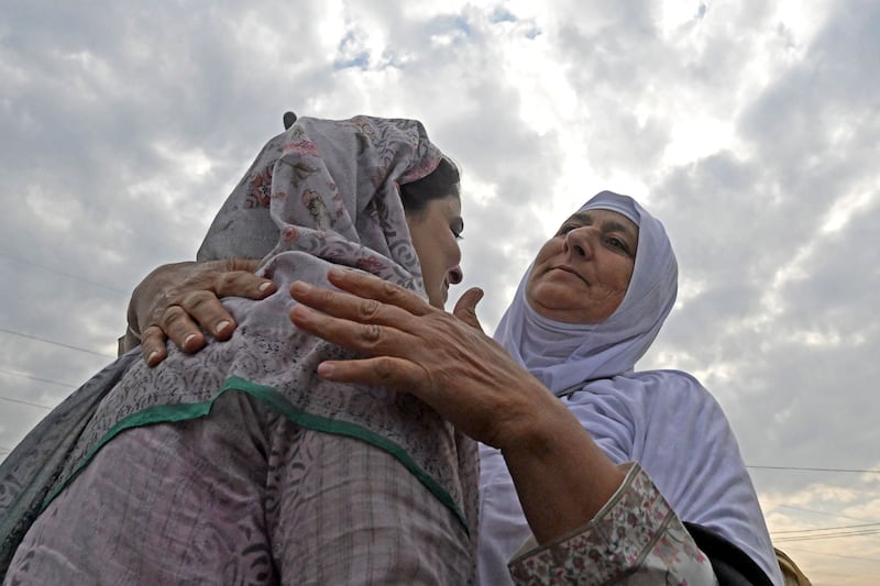 A pilgrim is embraced by her relative before leaving for the annual Hajj pilgrimage. AFP