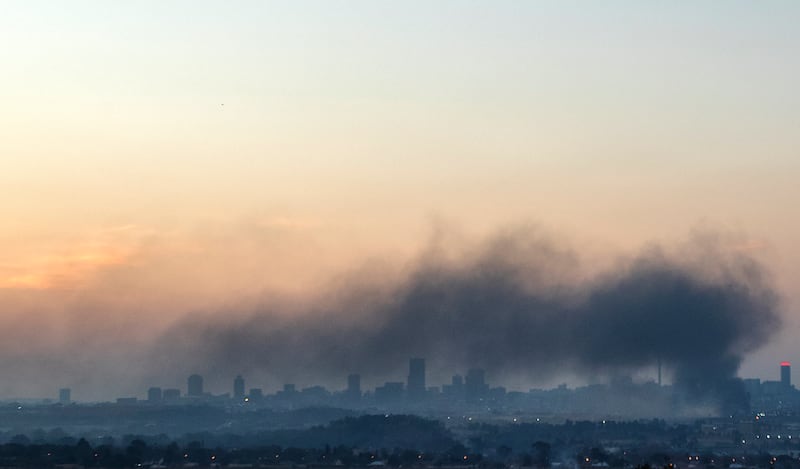 Smoke dominates the Johannesburg skyline. Mr Zuma was also jailed by South Africa's pre-1994 white minority rulers for his efforts to bring about legal equality for all citizens.