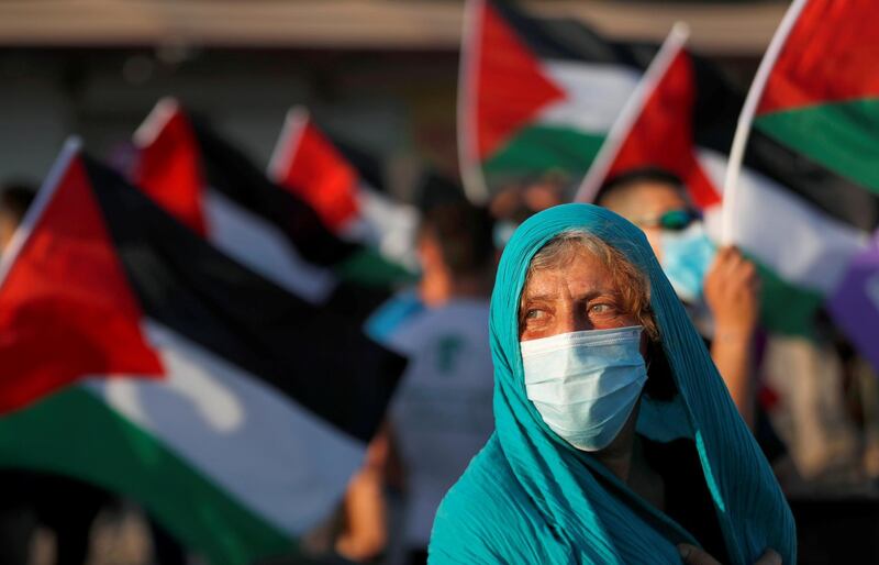 Peace activists take part in a protest against Israel's plan to annex parts of the Israeli-occupied West Bank, in the Palestinian town of Jericho. Reuters