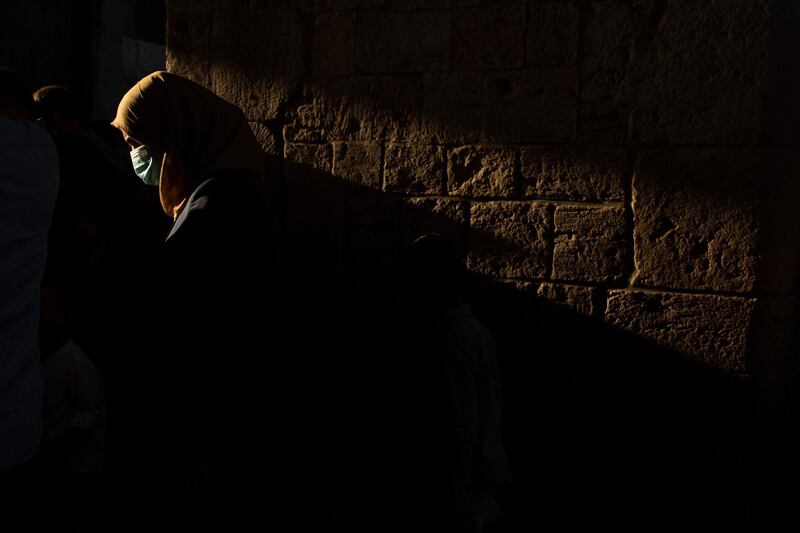 A woman leaves prayers for Eid Al Adha in the Old City of Jerusalem. AP Photo