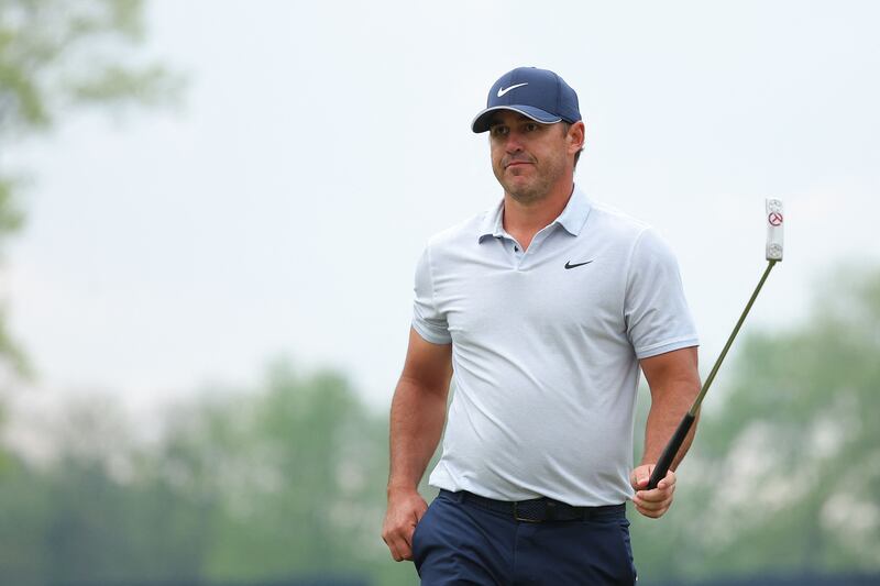 Brooks Koepka walks off the 18th green during the third round of the 2023 PGA Championship at Oak Hill Country Club. AFP