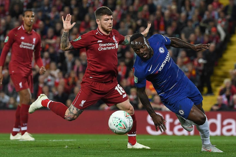 Liverpool's Spanish defender Alberto Moreno (L) vies with Chelsea's Nigerian midfielder Victor Mosesduring the English League Cup third round football match between Liverpool and Chelsea at Anfield in Liverpool, north west England on September 26, 2018. (Photo by Paul ELLIS / AFP) / RESTRICTED TO EDITORIAL USE. No use with unauthorized audio, video, data, fixture lists, club/league logos or 'live' services. Online in-match use limited to 120 images. An additional 40 images may be used in extra time. No video emulation. Social media in-match use limited to 120 images. An additional 40 images may be used in extra time. No use in betting publications, games or single club/league/player publications. /