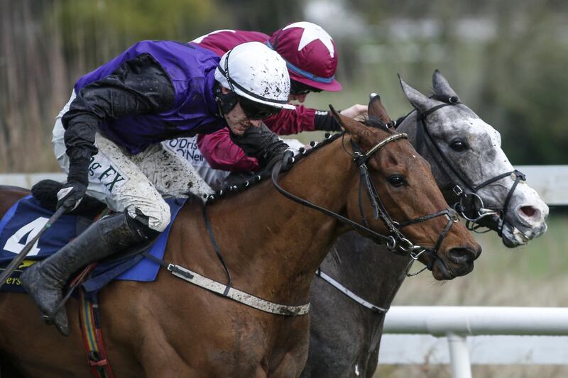 DUBLIN, IRELAND - FEBRUARY 04:  Paul Townend riding Mr Adjudicator (L) clear the last to win The Tattersalls Ireland Spring Juvenile Hurdle from Farclas (R) at Leopardstown racecourse on February 4, 2018 in Dublin, Ireland. (Photo by Alan Crowhurst/Getty Images)