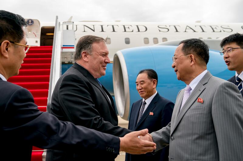 FILE - In this July 6, 2018, file photo, U.S. Secretary of State Mike Pompeo, second from left, is greeted by North Korean Director of the United Front Department Kim Yong Chol, center, and North Korean Foreign Minister Ri Yong Ho, second from right, as he arrives at Sunan International Airport in Pyongyang, North Korea. South Korea on Saturday, Aug. 25, 2018, called the U.S. decision to call off a trip to North Korea by Pompeo "unfortunate" and said continued diplomacy would be most crucial in resolving the nuclear standoff with the North. (AP Photo/Andrew Harnik, Pool, File)
