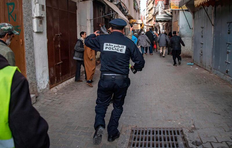 A Moroccan policeman patrols in the capital Rabat's district of Takadoum. AFP