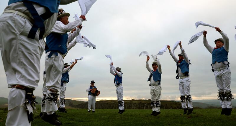 Members of Hexham Morrismen perform at sunrise to traditionally mark May Day in Henshaw, Northumberland, Britain May 1, 2023.  REUTERS / Lee Smith