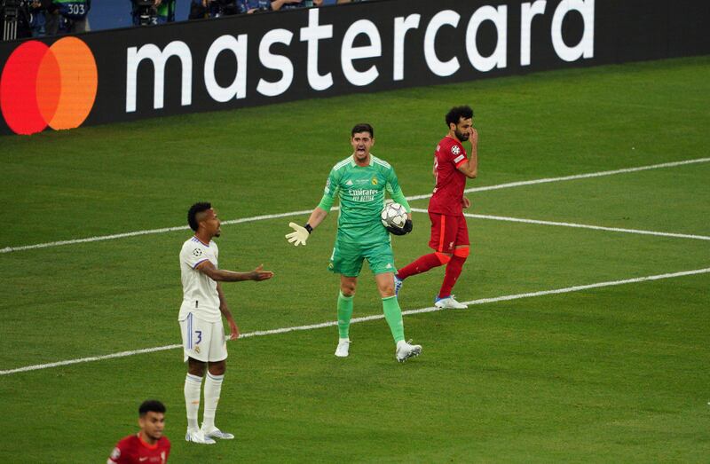 Real goalkeeper Thibaut Courtois screams at his defence after Liverpool hit the post in the first half. PA