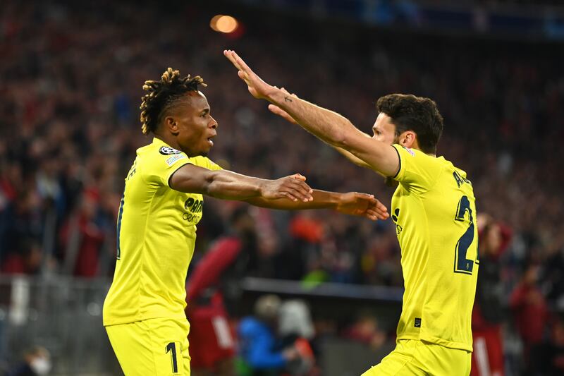 MUNICH, GERMANY - APRIL 12: Samuel Chukwueze of Villarreal CF celebrates with teammate Alfonso Pedraza after scoring their team's first goal during the UEFA Champions League Quarter Final Leg Two match between Bayern München and Villarreal CF at Football Arena Munich on April 12, 2022 in Munich, Germany. (Photo by Christian Kaspar-Bartke / Getty Images)