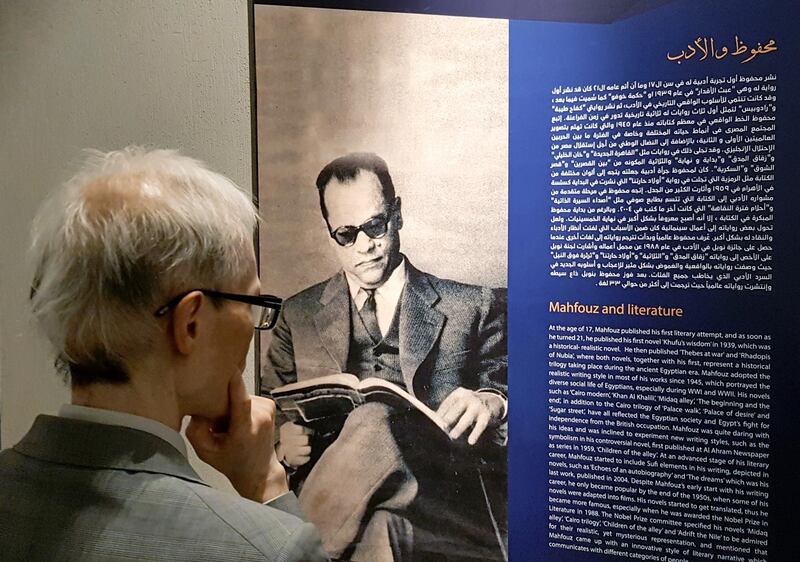 A visitor reads the biography of Mahfouz after the official opening of the museum. Reuters