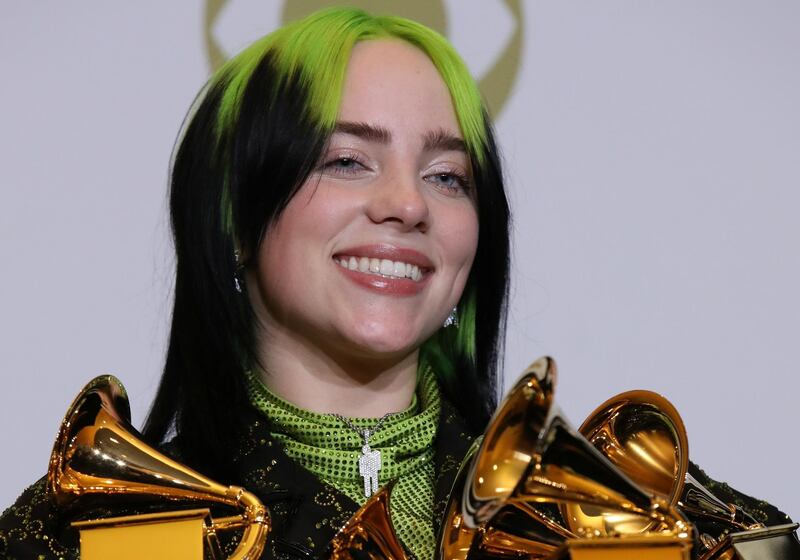 FILE PHOTO: 62nd Grammy Awards – Photo Room– Los Angeles, California, U.S., January 26, 2020 – Billie Eilish poses backstage with her awards to include Song of the Year for "Bad Guy" , Best New Artist, and Album of the Year for  "When We All Fall Asleep, Where Do We Go?". REUTERS/Monica Almeida/File Photo