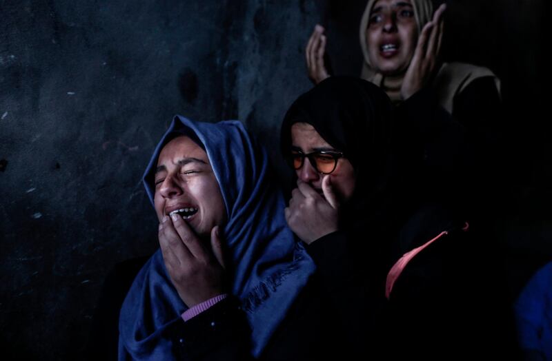 Relatives of Bilal al-Najjar, 17, mourn during his funeral in Khan Yunis in the southern Gaza Strip. AFP