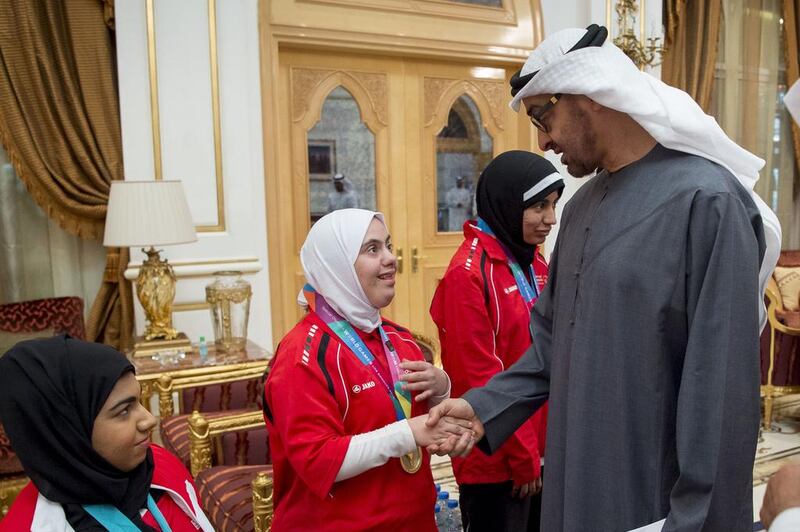 Sheikh Mohammed bin Zayed greets a member of the UAE Disabled Sports Federation during a Sea Palace barza in January. Rashed Al Mansoori / Crown Prince Court — Abu Dhabi
