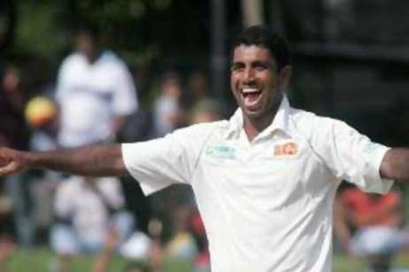 Sri Lanka's Dammika Prasad celebrates the dismissal of India's Virender Sehwag during their third cricket test match in Colombo August 10, 2008. REUTERS/Anuruddha Lokuhapuarachchi (SRI LANKA) *** Local Caption ***  COL10_CRICKET-INDIA_0810_11.JPG
