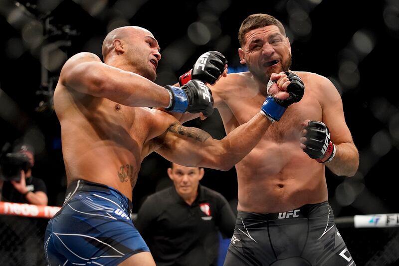 Nick Diaz, right, fights Robbie Lawler. AP Photo